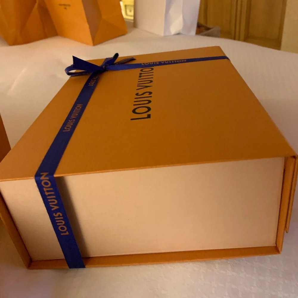 Brand new authentic smaller Luis Vuitton box with ribbon . Must have for closet!